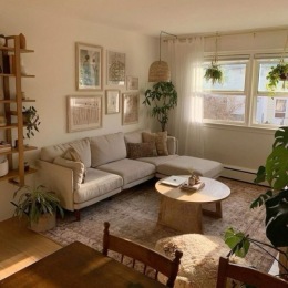 living room with seating and several plants